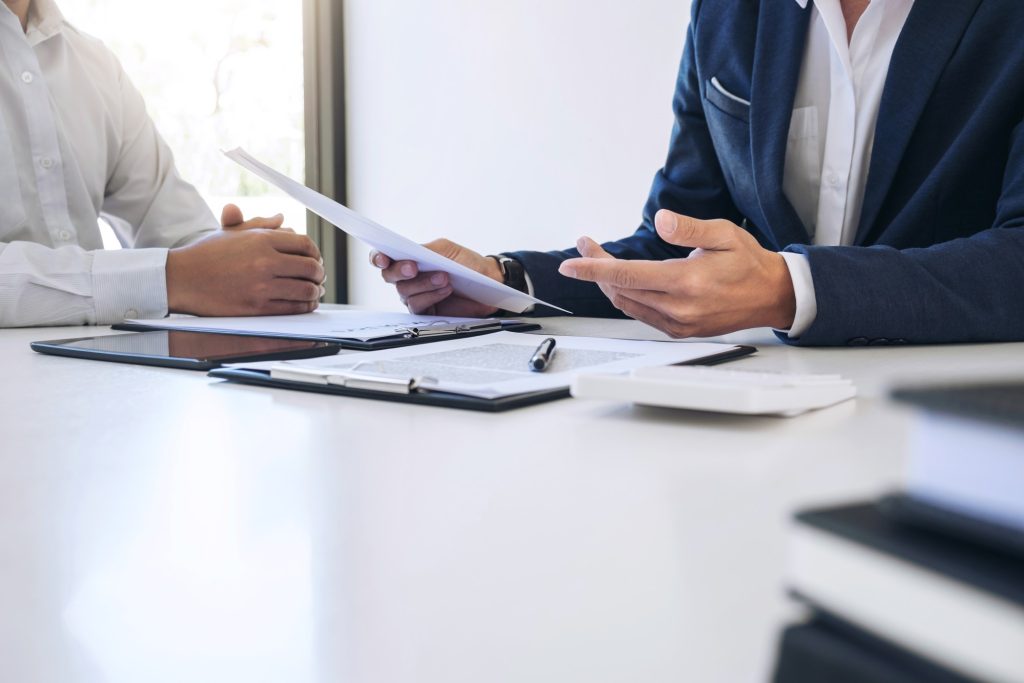 recruiter and job seeker discussing work history during interview